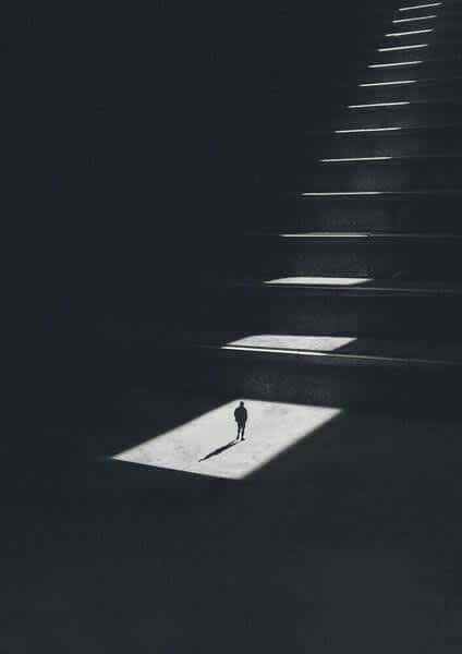 Solitary Figure on Illuminated Steps — phone wallpaper preview