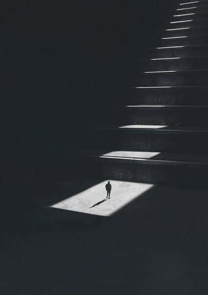 Solitary Figure on Illuminated Steps — phone wallpaper