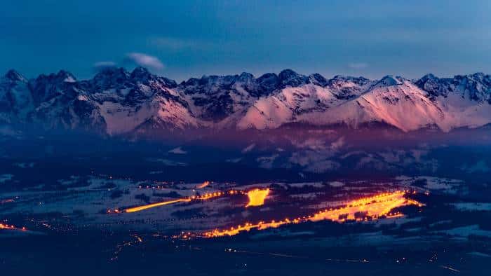 Twilight Glow on Snowy Mountain Peaks — desktop wallpaper